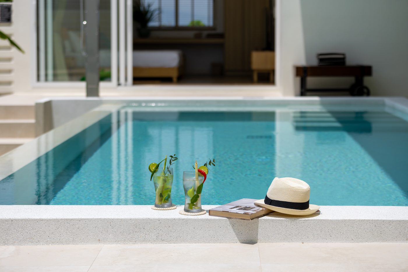 Cocktails and a sun hat on the edge of Villa Sue's private pool, Koh Samui